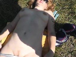 Pervert masturbate on sunbathing naked woman on wild beach and cumshot POV